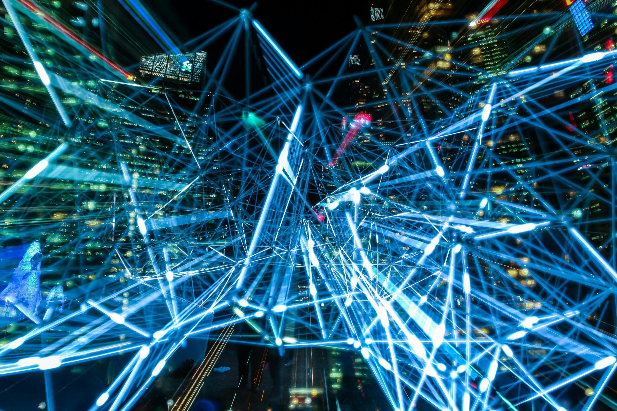 Dynamic urban scene showcasing interconnected light trails representing digital communication networks. Science.
